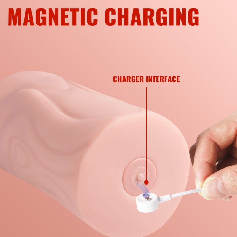 A hand connecting a magnetic charger to the base of the masturbator.
